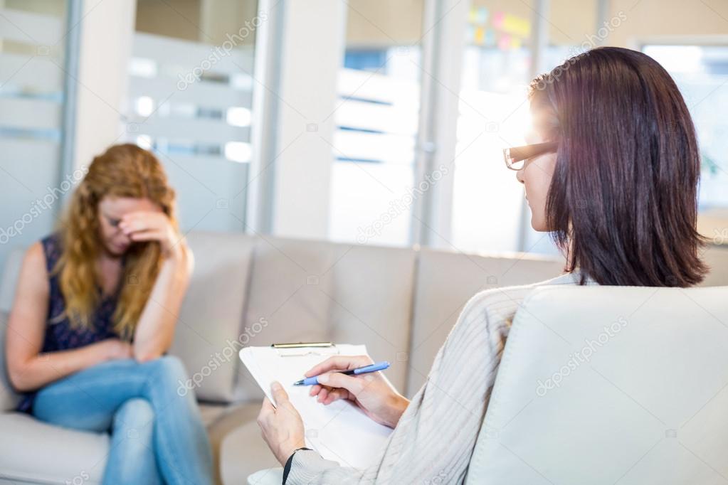 depositphotos 76210905 stock photo psychologist talking with her depressed